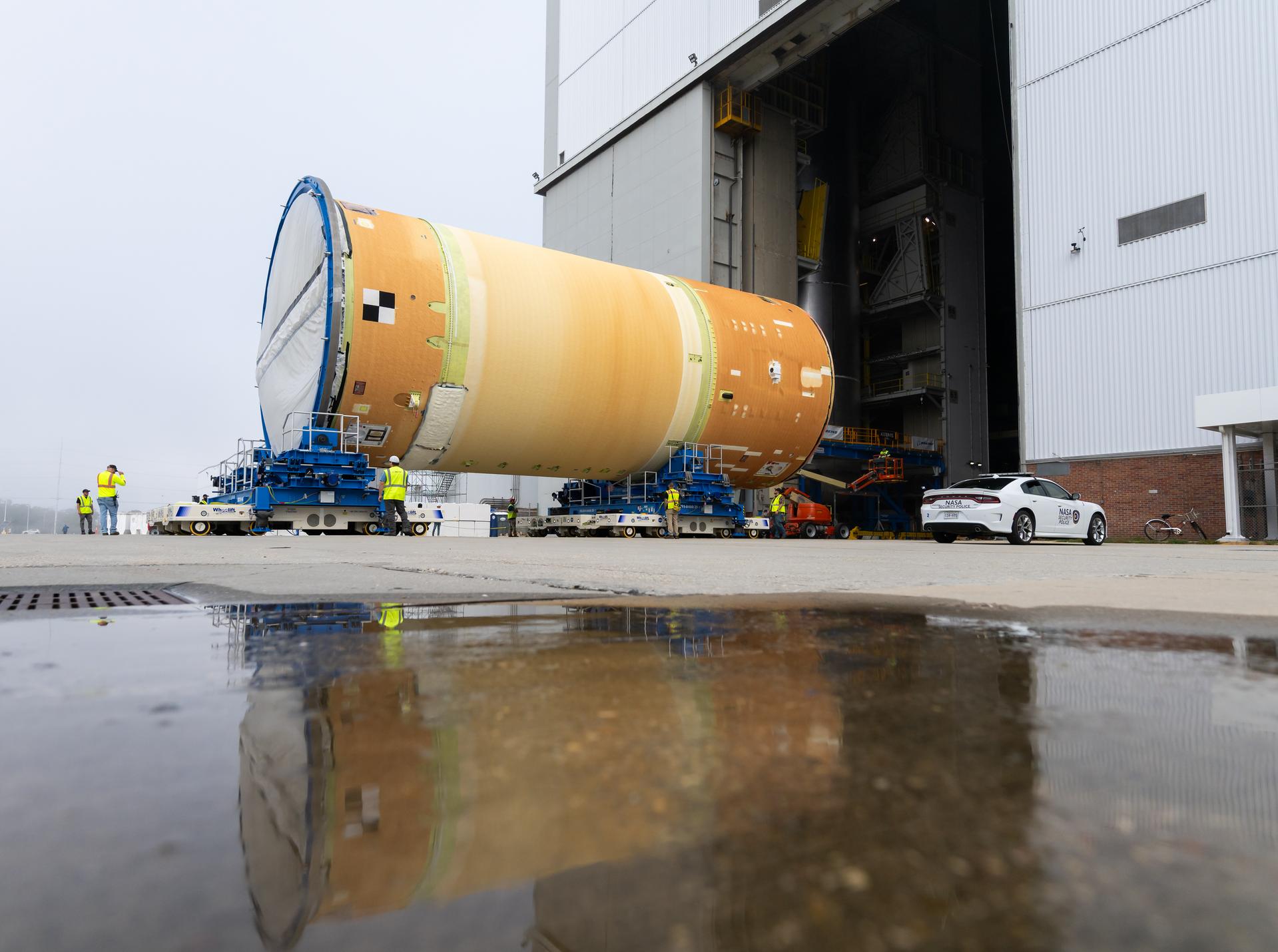 Move crews at NASA’s Michoud Assembly Facility in New Orleans, lift the forward-joined flight hardware for the agency’s SLS (Space Launch System) rocket out of a stacking cell in the vertical assembly building on Dec. 19, 2025. The forward join, which consists of the intertank, liquid oxygen tank, and forward skirt, will be used on the core stage slated for NASA’s Artemis III mission. Teams moved the flight hardware from the cell and set it atop self-propelled mobile transporters. The article was brought to the factory’s final assembly area on Dec. 27, 2025 where it will be mated to the core stage’s previously joined liquid hydrogen tank and undergo further integration.    The core stage, along with its four RS-25 engines, produce more than two million pounds of thrust to help launch NASA’s Orion spacecraft, astronauts, and supplies beyond Earth’s orbit and to the lunar surface for Artemis.